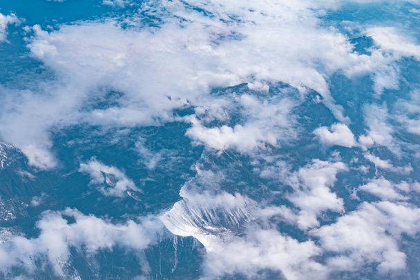 Mountain landscape. View from the airplane window. - Фото, зображення