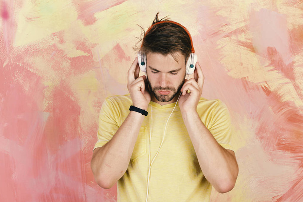 Musical lifestyle. American handsome bearded guy with headphones. - Fotoğraf, Görsel
