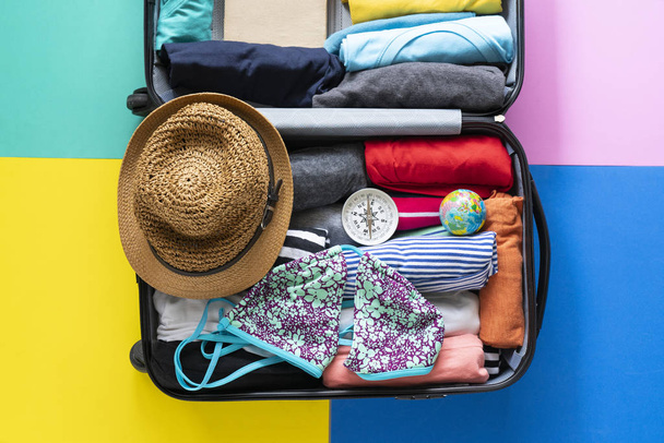 packing a luggage for a new journey and travel for a long weekend - 写真・画像