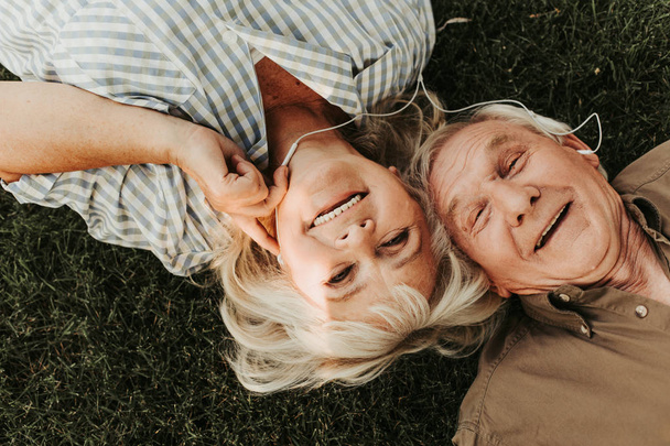 Hilarious laughing mature pair spending time together - Valokuva, kuva