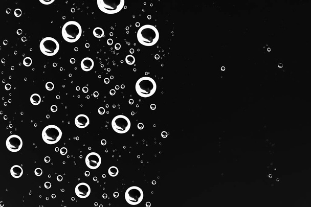 black wet background, raindrops on window glass, concept of autumn weather - Fotoğraf, Görsel