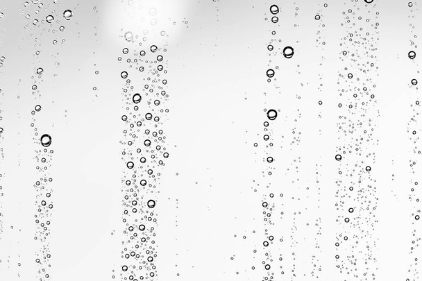 white wet background, raindrops on window glass, concept of autumn weather - Photo, Image
