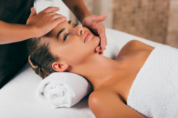 happy woman relaxing and having face massage - Photo, Image