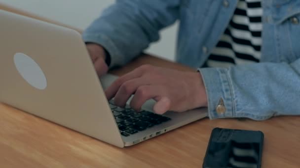 Man works at the laptop in office - Felvétel, videó