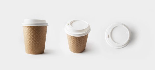 Blank take away kraft paper coffee cups with caps. - Photo, Image