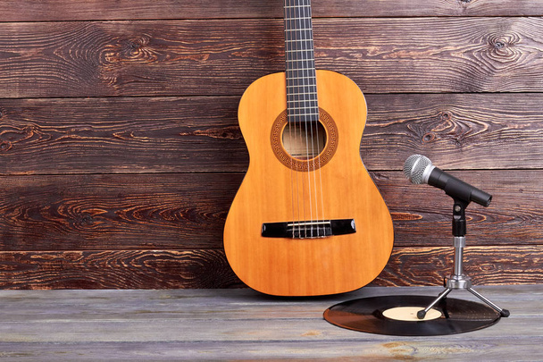 Acoustic guitar, vinyl record and microphone. - Fotografie, Obrázek