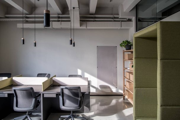 Stylish office in loft style with gray walls - 写真・画像