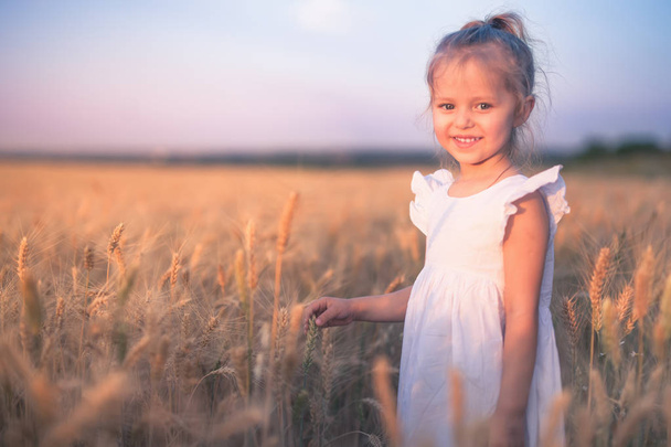 Happy Little Girl Outdoor At Wheat Field. End of Summer - Fotografie, Obrázek