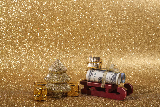 Christmas money gift on abstract gold glitters bokeh background - Фото, изображение