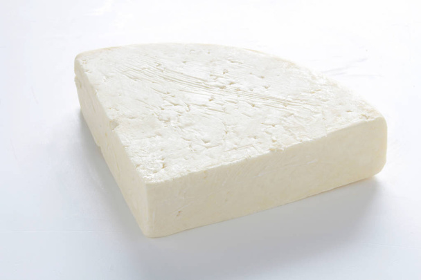 チーズの部分が白い背景で隔離 - 写真・画像