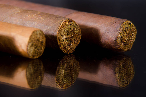 Handcrafted cigar made of tobacco leafs - Photo, Image