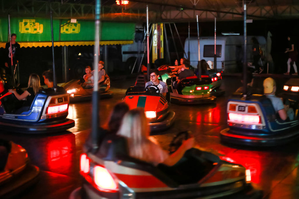 Vukovina, Croatia - August 15, 2018 : People riding on bumper cars in an amusement park on a fair in Vukovina, Croatia. - Valokuva, kuva