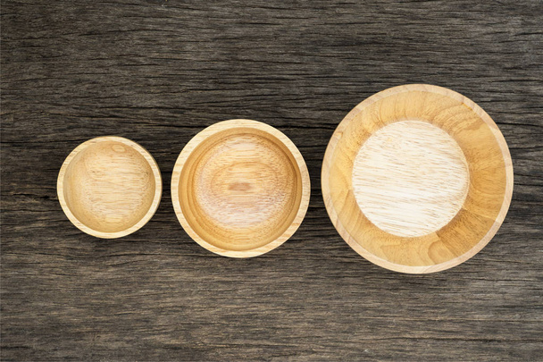 Top view of wooden three bowl on  wooden background - Foto, Imagem