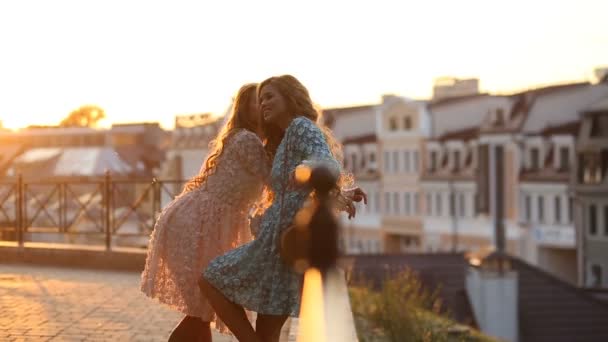 Two blond girlfriends communicate on summer terrace - Footage, Video