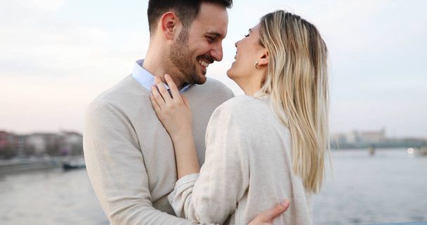 Happy couple in love hugging and smiling outdoor - Zdjęcie, obraz