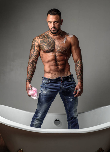 Muscular athletic sexy male with naked torso. Man with tattooed body. Confident and handsome Brutal man. Mens health. Beautiful male torso. - 写真・画像