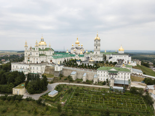 Aerial view to largest Orthodox church complex and monastery - The Dormition Pochayiv Lavra was founded on a mountain near the town of Novy Pochaev in 1240, Ukraine - Fotó, kép