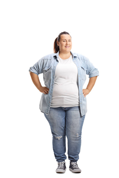 Overweight woman standing with hands on her waist isolated on white background - Photo, Image
