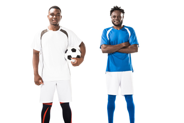 confident athletic young african american soccer players smiling at camera isolated on white  - Photo, Image