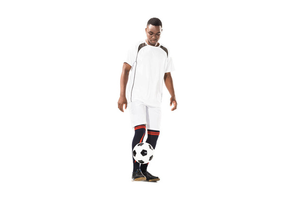young african american sportsman playing with soccer ball isolated on white - Photo, Image