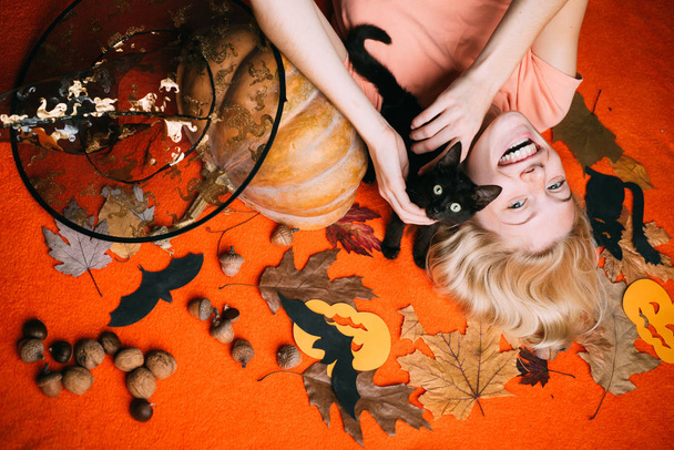 Witch with Pumpkin and black cat. Halloween wide banner with Sexy Woman. Halloween wide poster for Happy halloween celebrate. Halloween decoration and autumn concept. - Foto, Imagem