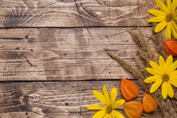 Autumn flowers on wooden background with copy space - Zdjęcie, obraz