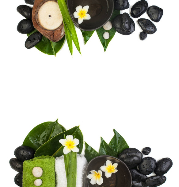 Top view spa sets (stones, towels, leaves, flowers) for tropical healthy therapy - Photo, Image