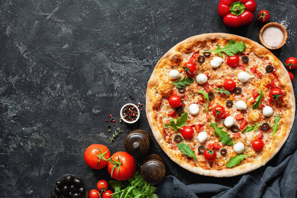 Italian Pizza On Black Concrete Background. Copy Space For Text. Tasty Pizza - Фото, изображение