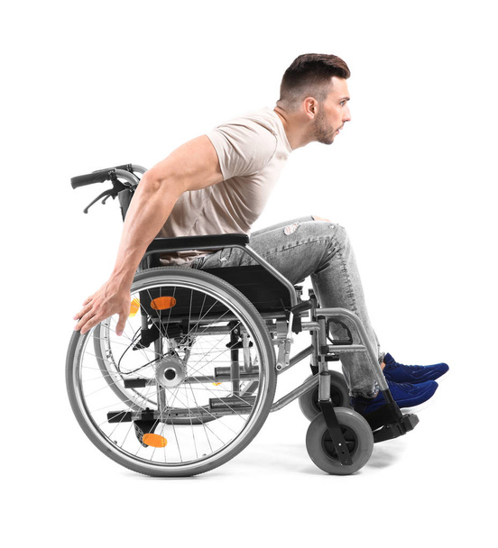 Young man in wheelchair on white background - Photo, Image