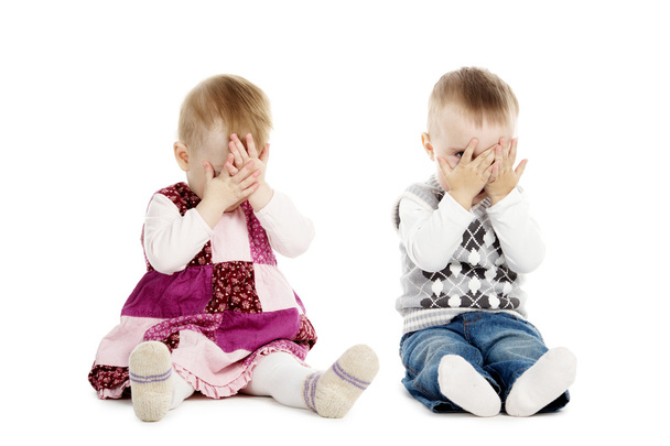 Little boy and girl covers his face - Photo, Image