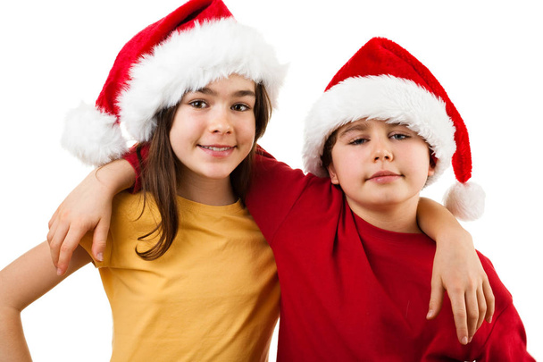 Boy and girl in Santa's hats - Foto, Imagem
