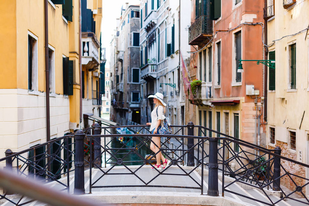 Beautiful Girl Is Standing By the River in Venice, Italy - 写真・画像
