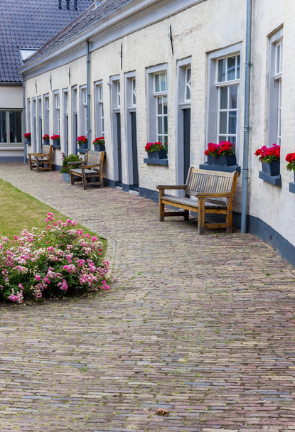 Benches in front of white houses in Doesburg, Netherlands - Photo, Image