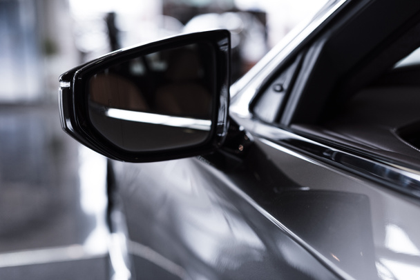 close up view of luxury shiny car in auto salon - Zdjęcie, obraz