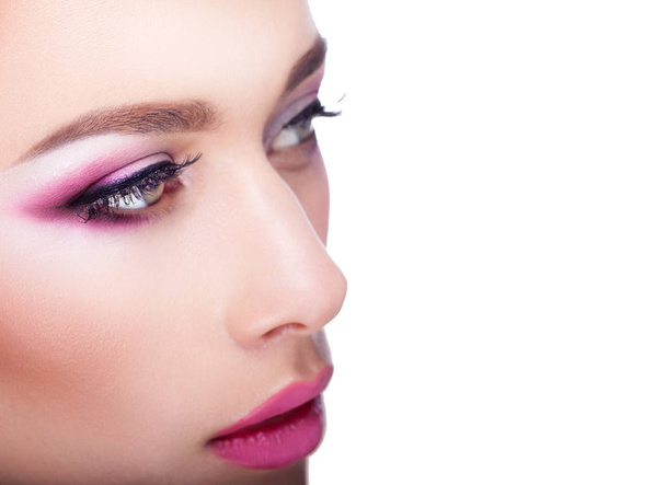 close up of portrait of young woman with color make up - Fotoğraf, Görsel