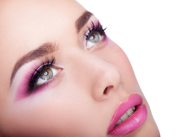 close up of portrait of young woman with color make up - Foto, afbeelding
