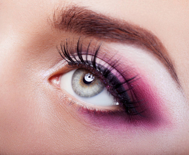 close up of female eye with color make up - Foto, Bild