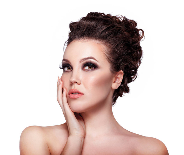 Young woman with glamorous makeup and high fashion hairstyle on white background - Фото, зображення
