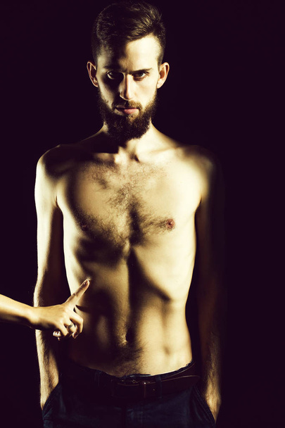 slim bearded man with thin bare torso isolated on black - Foto, imagen