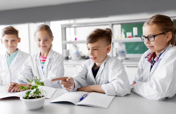 kids or students with plant at biology class - Photo, image