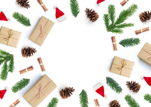 Christmas present and natural composition background with gifts and fir tree branches. - 写真・画像
