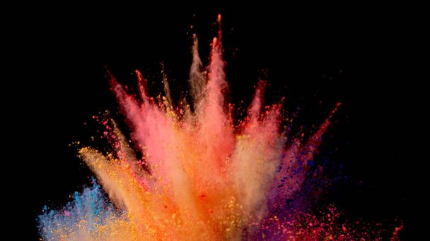 Explosion of coloured powder isolated on black background. Abstract colored background - Фото, зображення