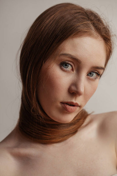 Woman with long thick straight hair tying around neck - Foto, immagini