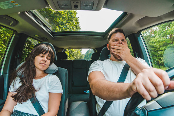 couple in car. tired driver. road trip. summer time - Photo, Image