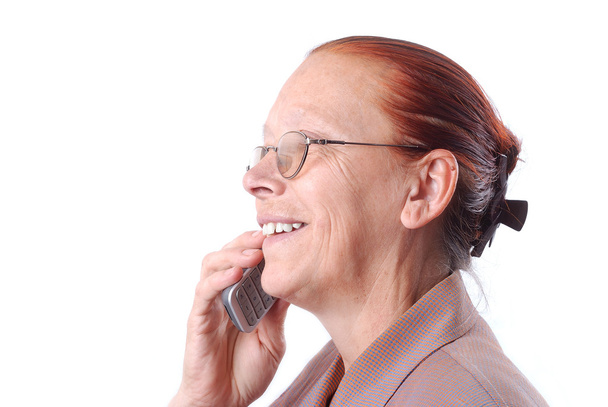 Middle aged woman talking on phone - Fotoğraf, Görsel