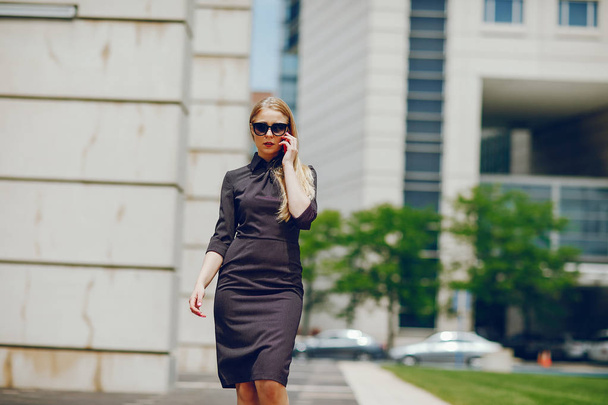 businesswoman in a summer city - Photo, image