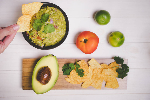 Guacamole Avocado with chips mexican food flat lay top view - Fotó, kép