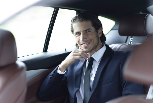 successful man sitting in the car - Фото, изображение