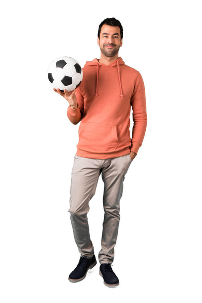 Full body of Man in a pink sweatshirt with soccer ball - Фото, изображение