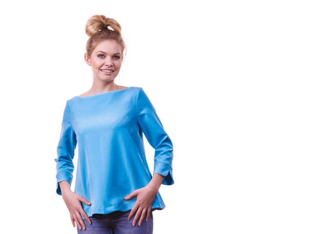 Happy adult woman presenting her casual beautiful outfit, long sleeved blue top. - Φωτογραφία, εικόνα